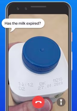 A still from a screen recording of a Be My Eyes call where the user is asking what the best before date is on a drink.