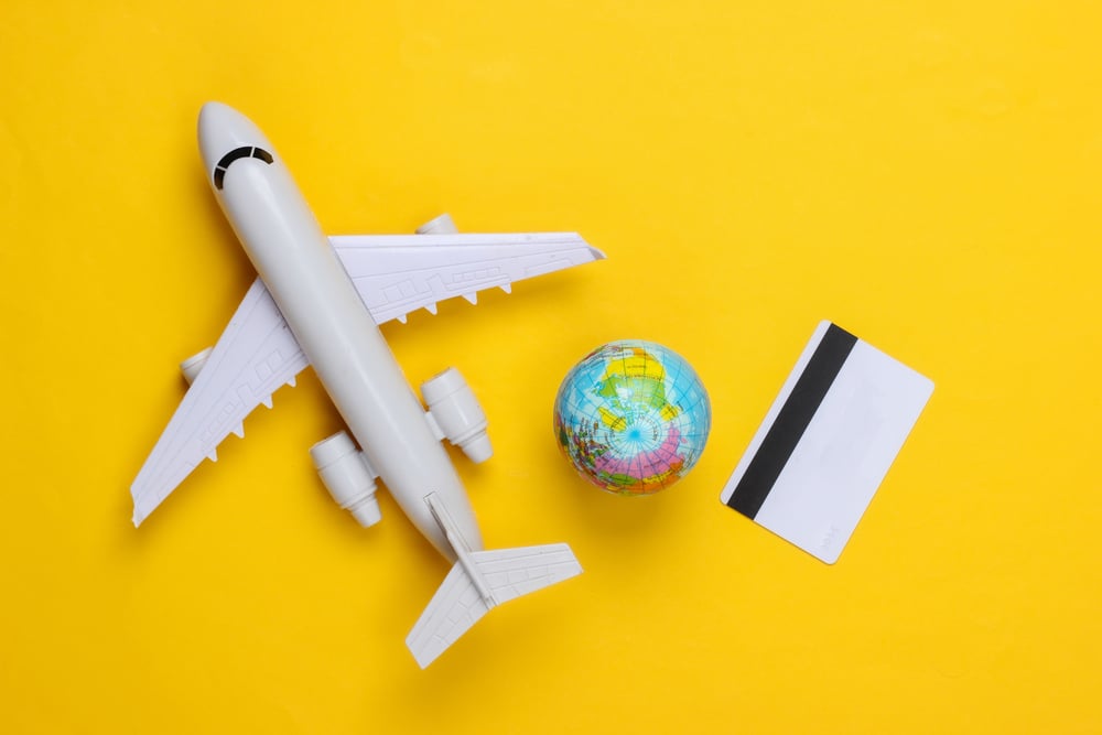hero-prepaid-travel-cards-yellow-plane-card-globe.jpg