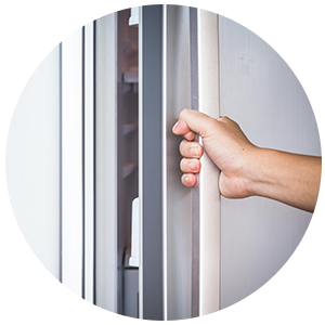 Caucasian hand opening fridge door