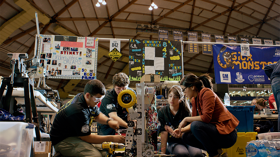 Robotics team working on a project 