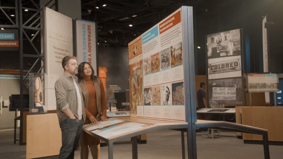 Image of two people in the Race Exhibit