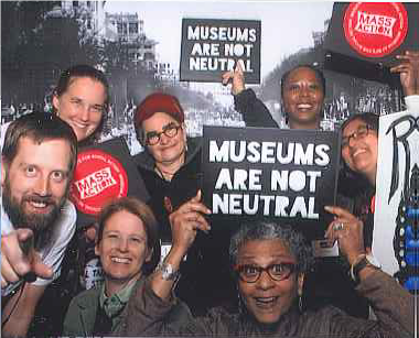 Museum staff members holding museums are not neutral signs 
