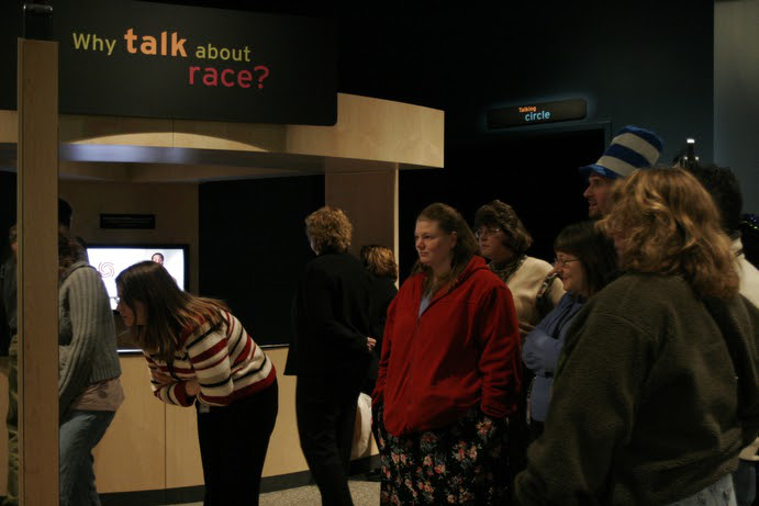 Museum patrons explore the RACE exhibit