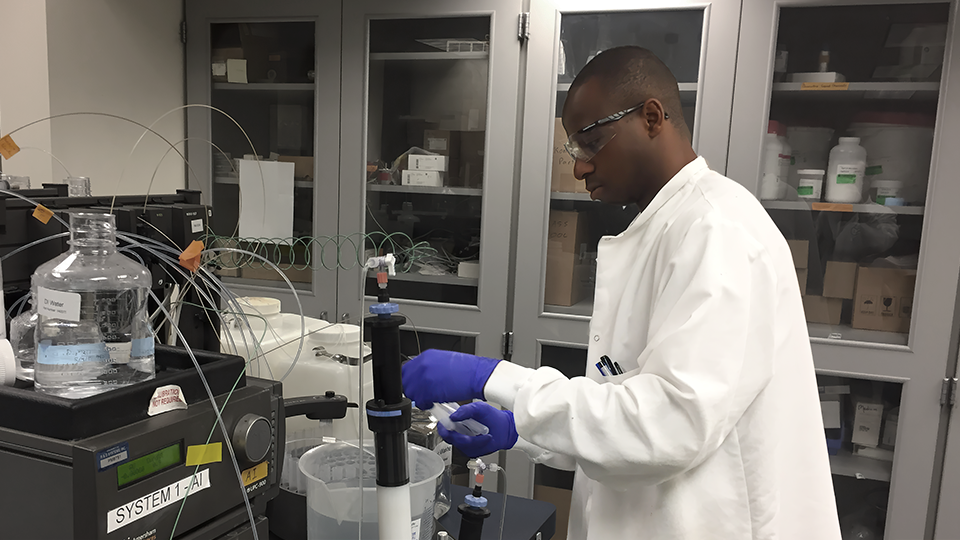 Phil Ayeni working in the lab 
