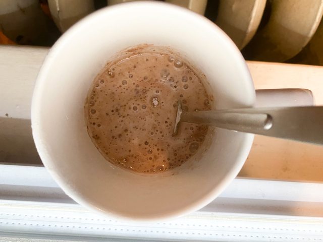 Mug of hot chocolate with a spoon