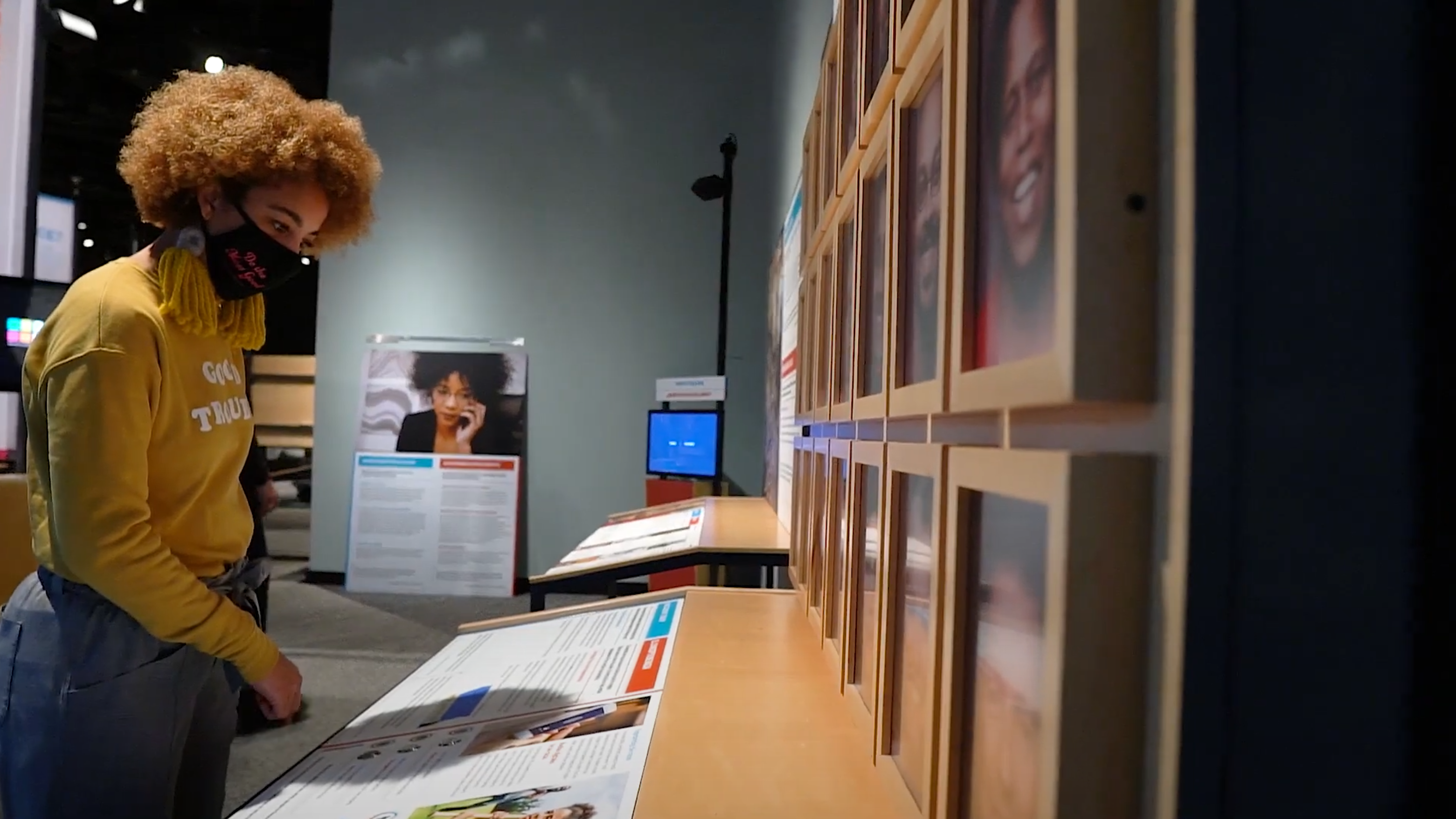 Alex West Steinman reads a plaque in the RACE exhibit. 