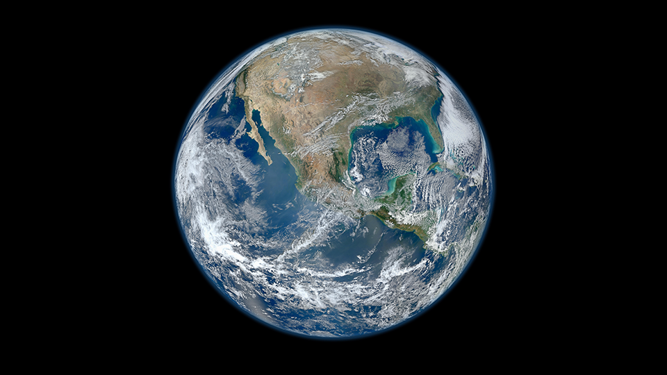 A photo of Earth from space. All of Earth is visible - it's daylight on this side of Earth.