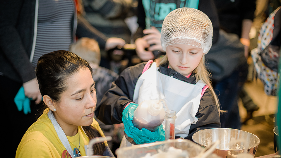 Image of women cooking with girl