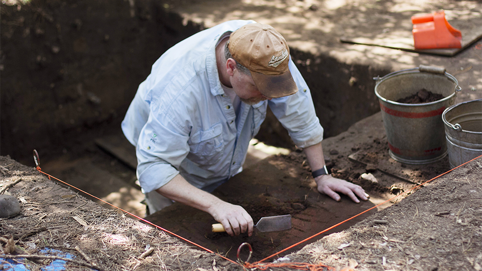 An archeologist working in the field.