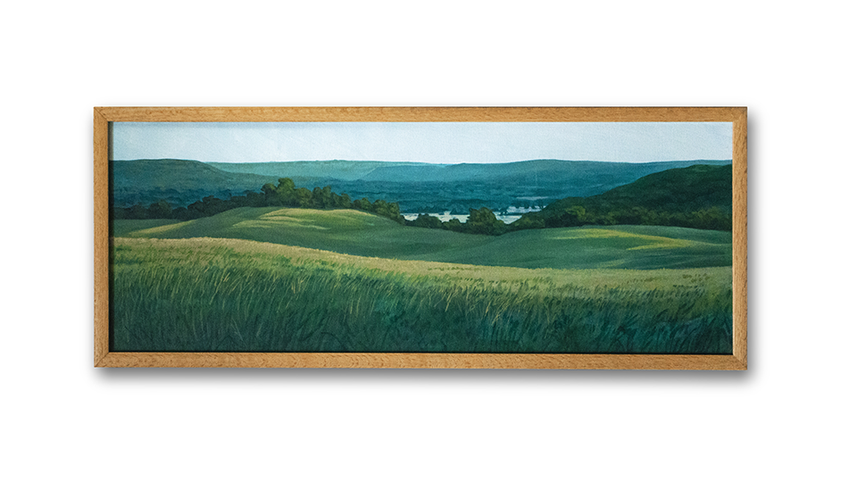 A photo of a landscape painting of a green field. 