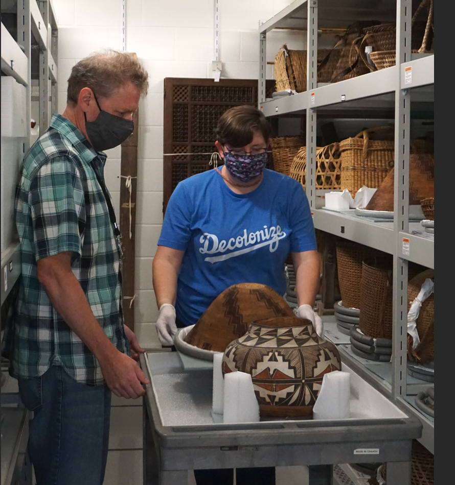 Dr. Ed Fleming and Conservator Rebecca Newberry handling archaeology items in the Science Museum collection vault