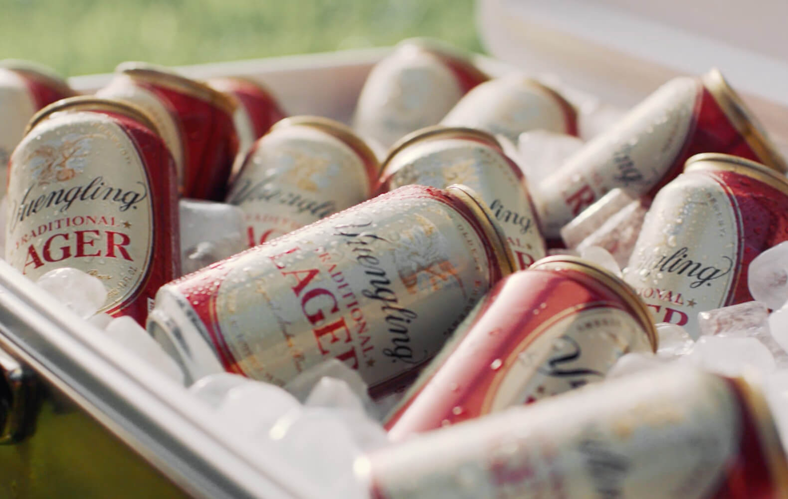Cooler full of ice cold cans of Yuengling Lager
