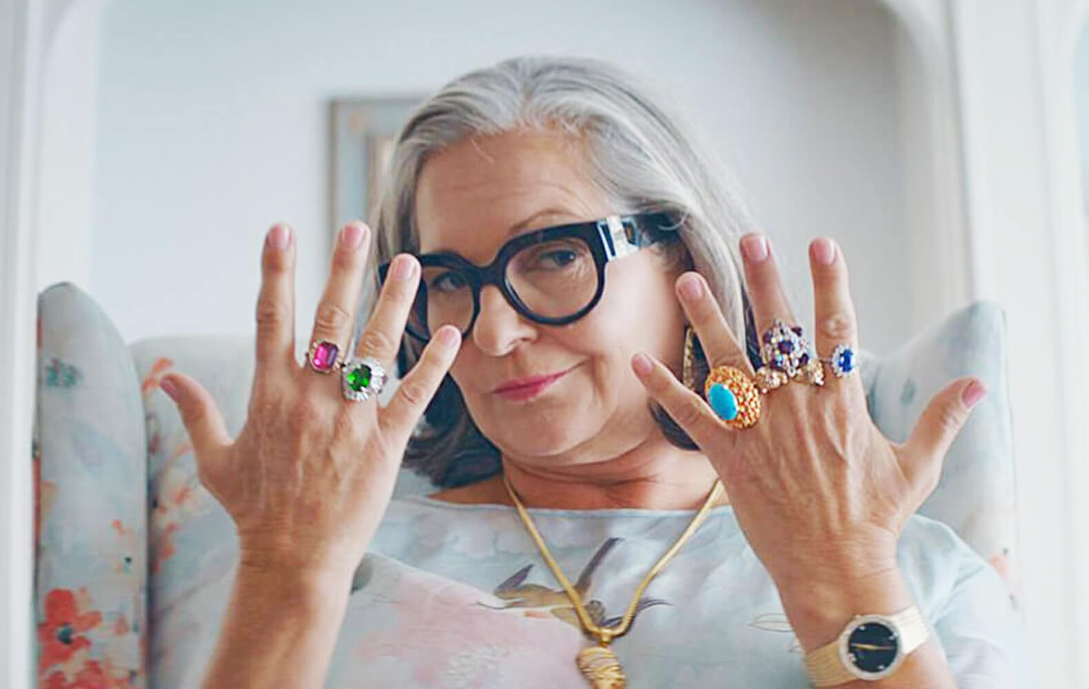 woman showing her jewelry on both hands