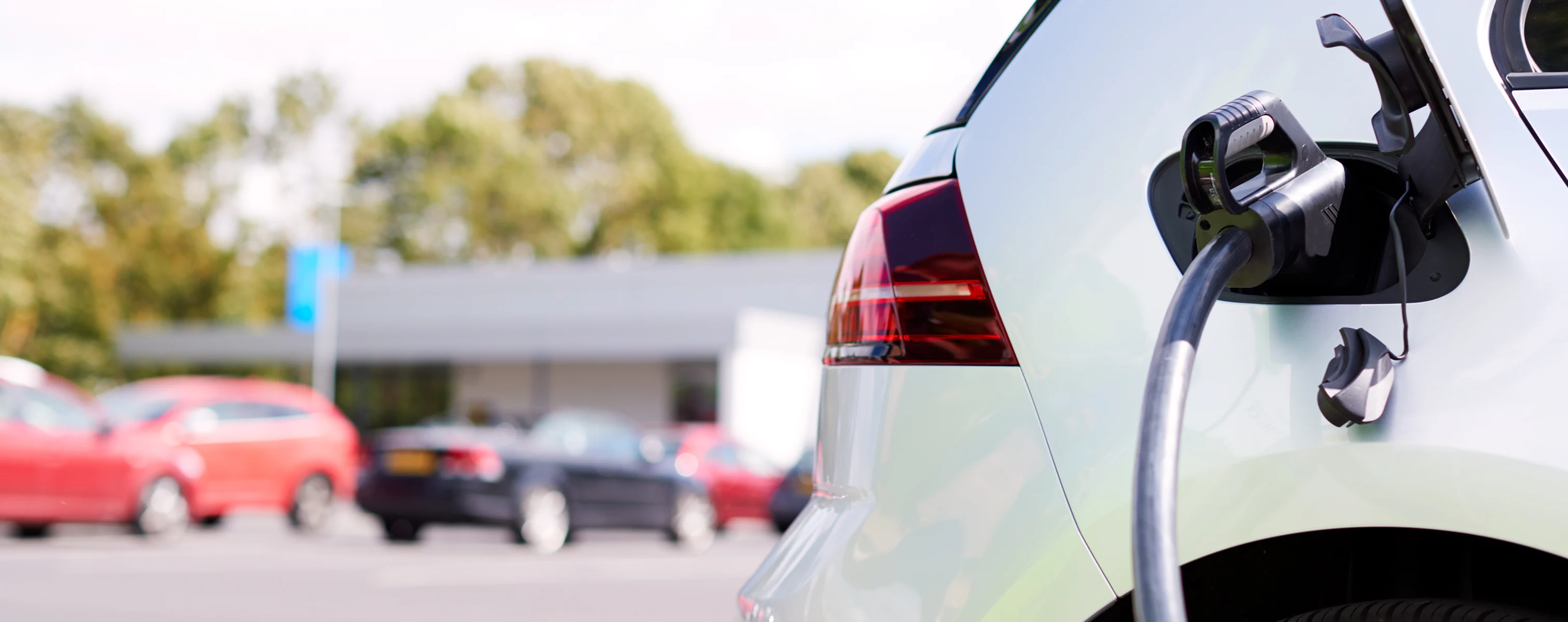 Electric vehicle charging at a charging station