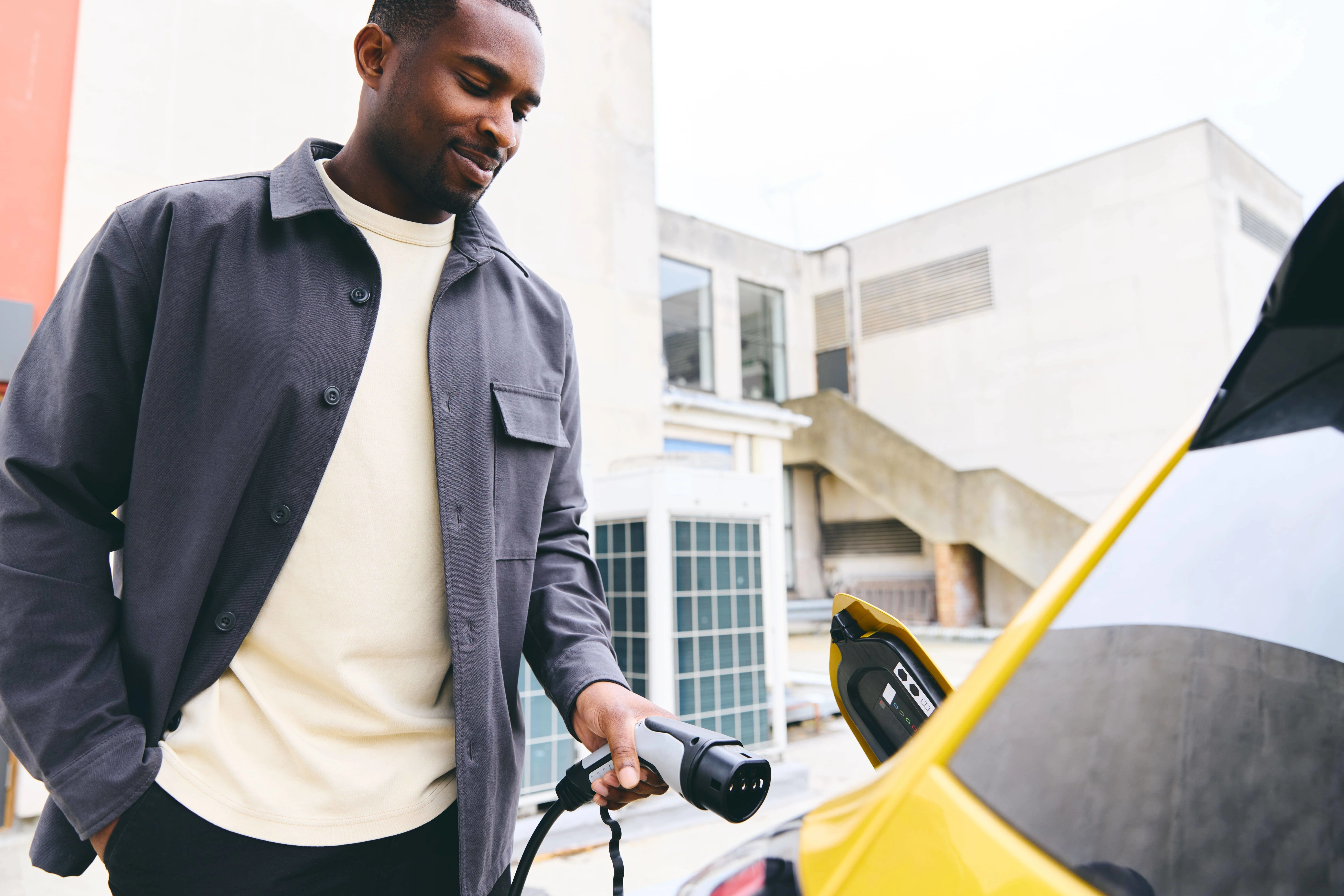 guy charging EV