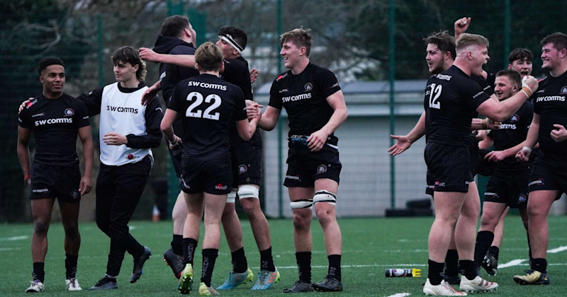 Young rugby players celebrating