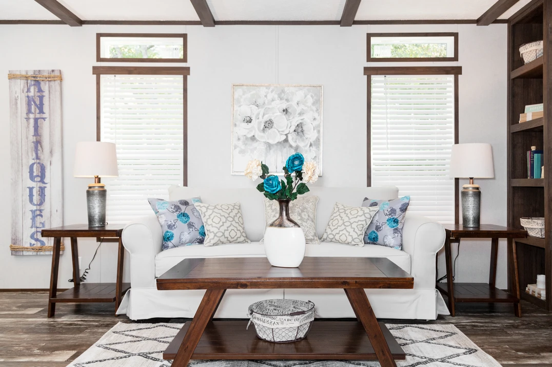 Living room with coffee table, couch, and area rug