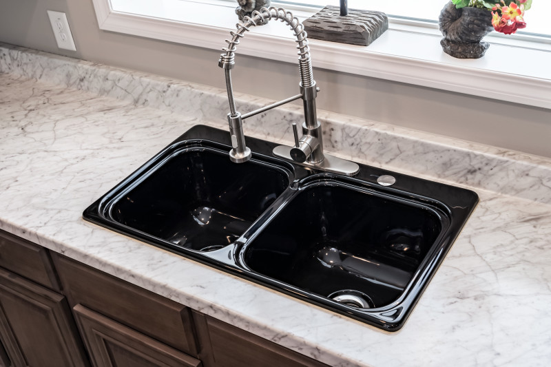A double basin black kitchen sink