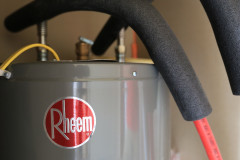 Close up of a Rheem® water heater in a Clayton Built® home.
