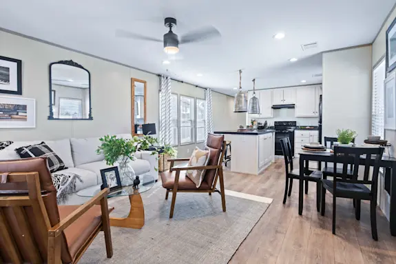 The Porch Living Series 16682A features an open floor plan and a covered front porch.