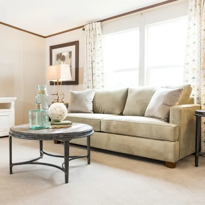 You'll love this chic living room from the Pride home, which offers a relaxing feeling with plush carpeting, neutral color combos and plenty of open space.