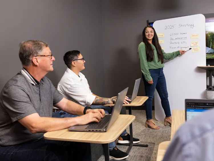 Clayton technology team members work together to solve business needs.