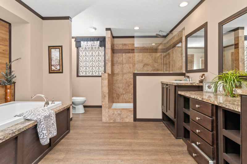 Spa-like master bathroom suite with separate tub and shower, plus a double vanity.