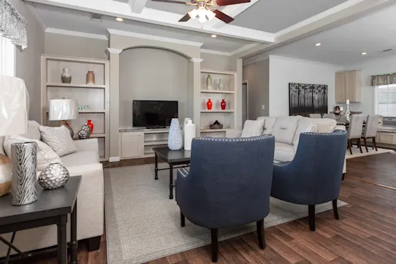 The Normandy is a traditional home featuring ceiling beams and a built-in entertainment center.