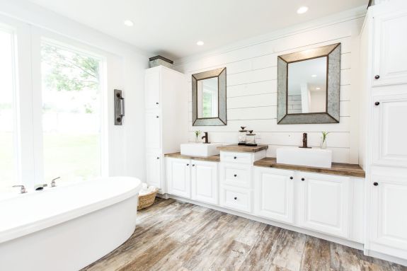 The Lulabelle is where farmhouse and luxury combine. Check out the primary bathroom with its large windows for natural light, a soaker tub, double vessel sinks and shiplap backsplash.