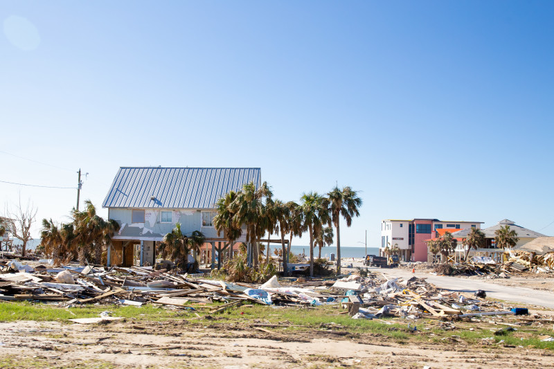 Outside image of the hurricane damage to a neighborhood of homes.