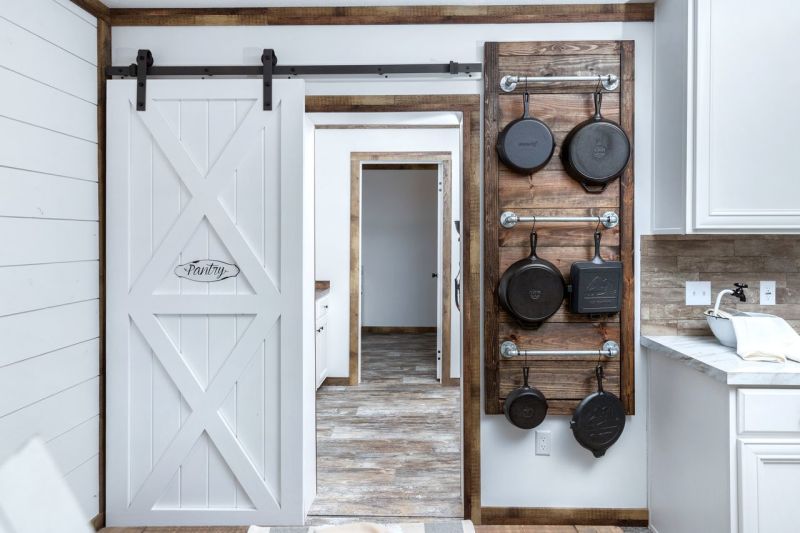 The door to a walk-in pantry in a manufactured home.