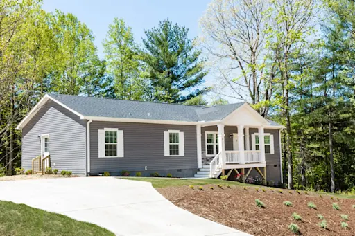 The Elite 60 features a modern exterior and a focal point porch that's perfect for sunny, summer days.