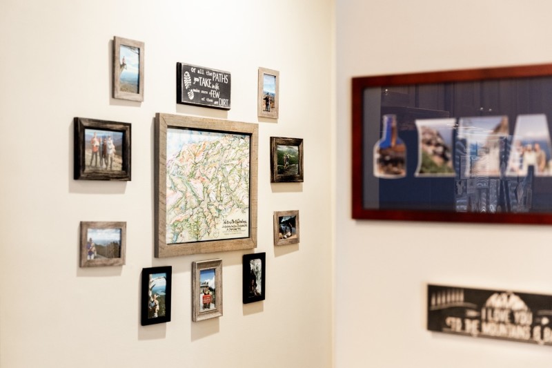 Family photos displayed on gallery wall