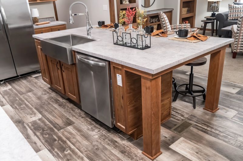 There's a wooden kitchen island with a sink and dishwasher built in.