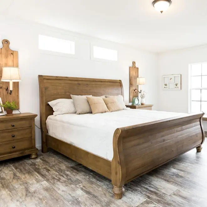The bedroom in The Lulamae features several windows to let in ample natural light.