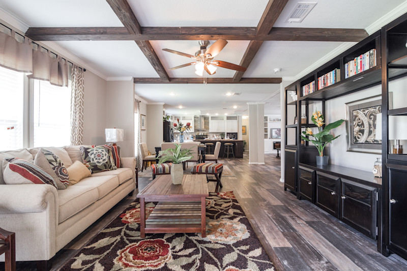 A large modular home floor plan with ceiling beams and open windows.