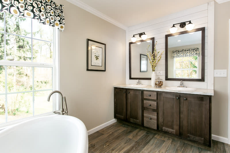 Manufactured home master bathroom with large white tub.