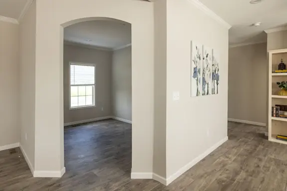 The [model name] has a flex space with an arched doorway ready to be used as a home office, a craft room or whatever you need.