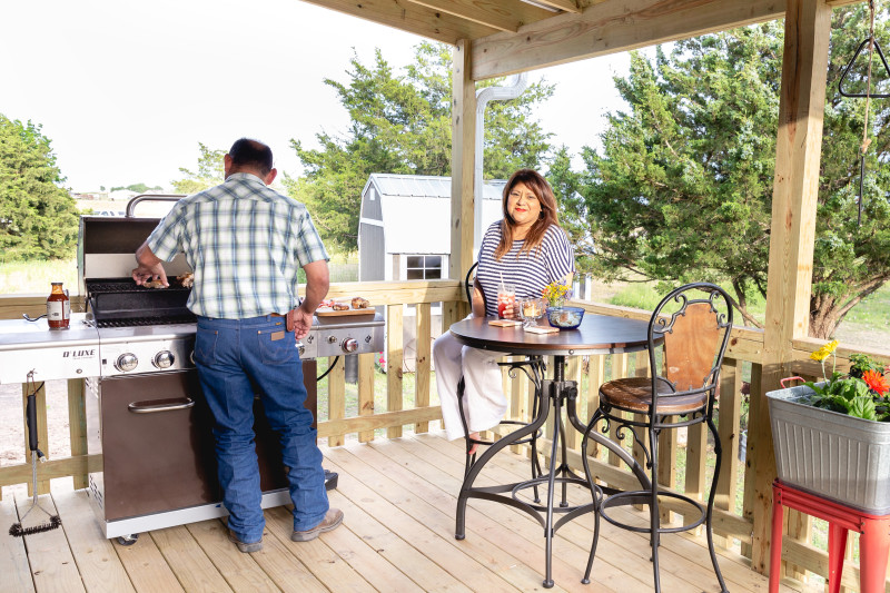 Couple grills on prefab back porch