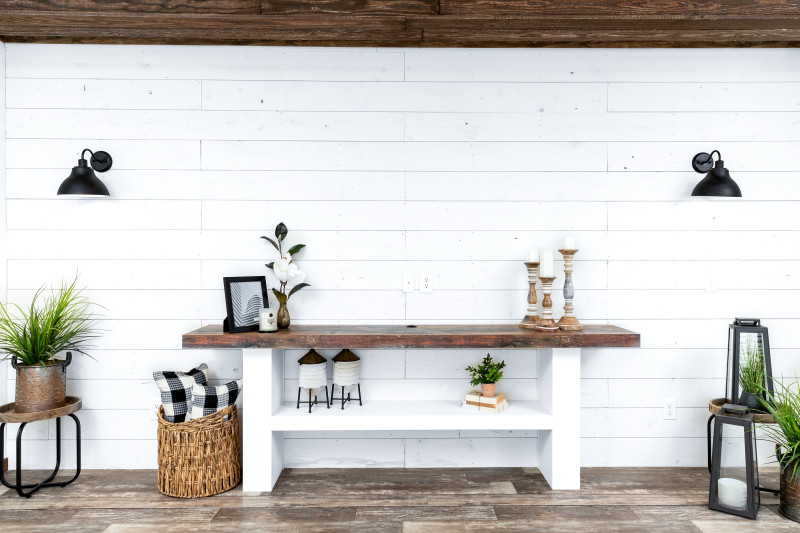 Shiplap wall with farmhouse table built in with natural wood elements