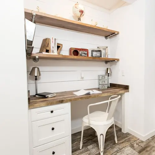 Industrial shelving and built-in drawers create plenty of office space in The Lulamae.