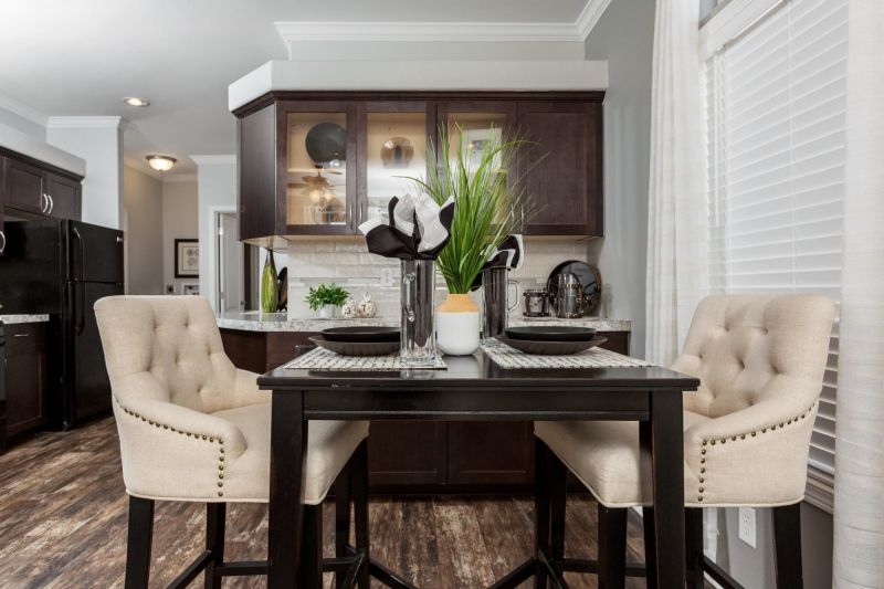 Dining area centered with kitchen in background