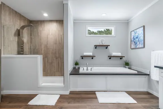 The [model name] features a rainfall shower and floating shelves above the bathtub.