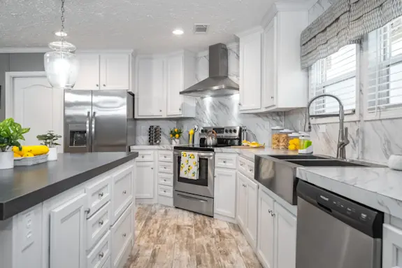  The Cascade features a kitchen with gorgeous quartz-style continuous countertops and sleek stainless steel appliances.