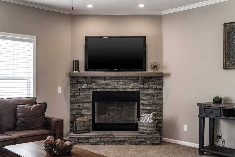 Living area of the Mason model with large fireplace feature.