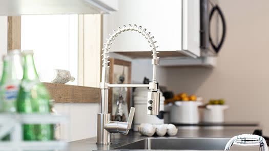 Manufactured home farmhouse with stainless steel sink and gooseneck faucet