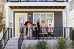 The Cebreros family standing on their porch