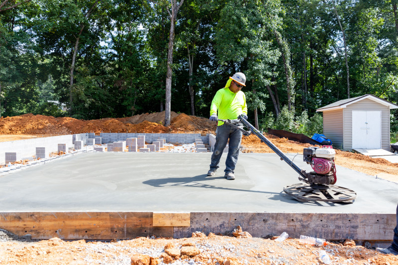 Man laying foundation for a manufactured home.