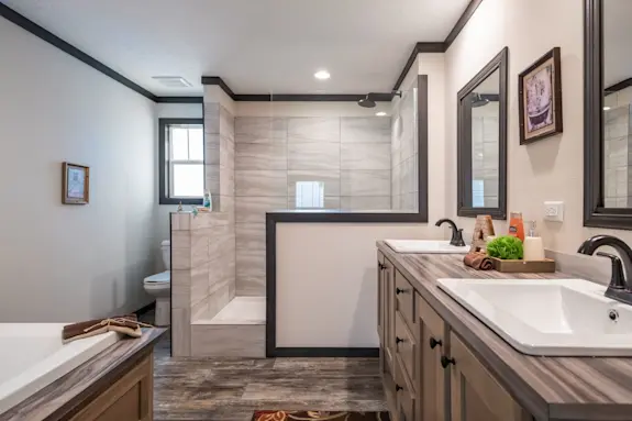 The [model name] features a large walk-in shower and drop-in tub.
