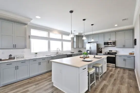 The Edgewood will make your jaw drop, especially when you see its spacious, modern kitchen with stretching countertops, three picture windows, paneled cabinets, stainless steel appliances and the gorgeous island with extra cabinet space.